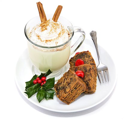 Plate of Christmas fruitcake and delicious frothy eggnog isolated on white. Photographie de stock - Aubaine LD & Abonnement, Code: 400-07894517