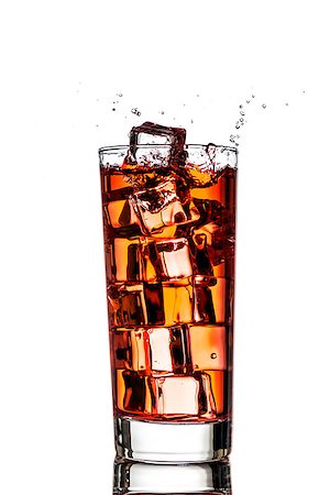 Ice splashing in cup of tea over white background Stock Photo - Budget Royalty-Free & Subscription, Code: 400-07894817