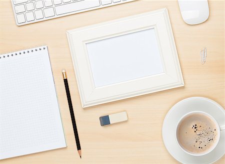 desktop work desk background - Photo frame on office table with notepad, computer and coffee cup. View from above Stock Photo - Budget Royalty-Free & Subscription, Code: 400-07894856
