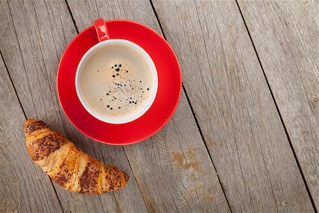 simsearch:400-06142439,k - Cup of coffee and fresh croissant on wooden table with copy space Stock Photo - Budget Royalty-Free & Subscription, Code: 400-07894885