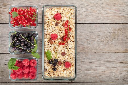 simsearch:400-08113690,k - Healthy breakfast with muesli and berries. View from above on wooden table with copy space Stock Photo - Budget Royalty-Free & Subscription, Code: 400-07894908