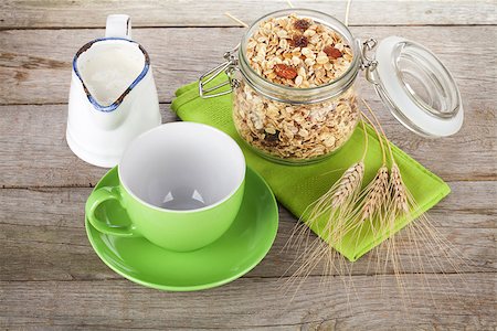 porage - Healthy breakfast with muesli and milk. On wooden table Stock Photo - Budget Royalty-Free & Subscription, Code: 400-07894900