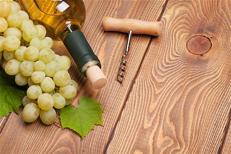 simsearch:400-08110621,k - White wine bottle and bunch of white grapes on wooden table background with copy space Stock Photo - Budget Royalty-Free & Subscription, Code: 400-07894947