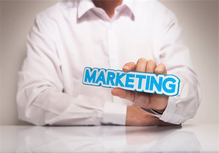 simsearch:400-08187507,k - Man hand holding the word Marketing, blue and beige tones, concept image for illustration of marketing solutions Stock Photo - Budget Royalty-Free & Subscription, Code: 400-07895195