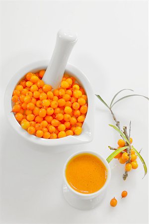 Seabuckthorn Berries and juice on white Background Stock Photo - Budget Royalty-Free & Subscription, Code: 400-07895299