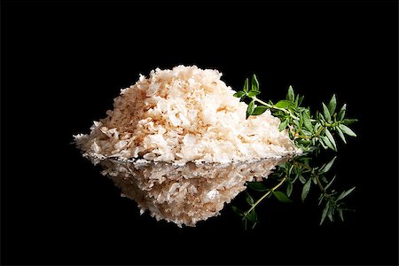 simsearch:400-08070604,k - Natural sea salt heap isolated on black background with fresh herb thyme. Luxurious sea salt. Stockbilder - Microstock & Abonnement, Bildnummer: 400-07895364