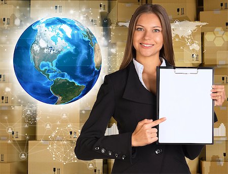 simsearch:400-07895693,k - Businesswoman hold paper holder. Earth and wall of cardboard boxes as backdrop. Element of this image furnished by NASA Stock Photo - Budget Royalty-Free & Subscription, Code: 400-07895662
