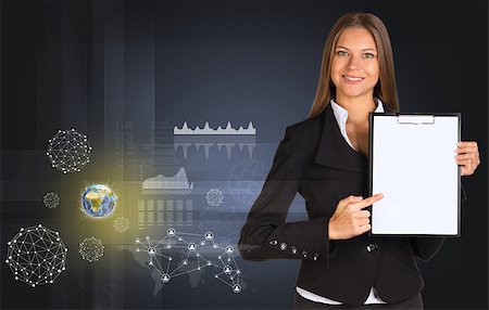 simsearch:400-07895693,k - Beautiful businesswoman in suit holding paper holder. Earth, network and graphs in background. Elements of this image furnished by NASA Stock Photo - Budget Royalty-Free & Subscription, Code: 400-07895687