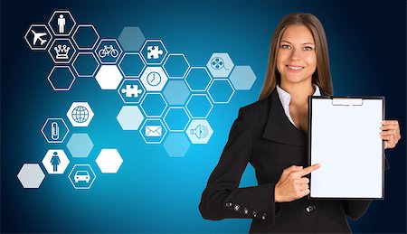 simsearch:400-07895693,k - Beautiful businesswoman in suit holding paper holder. Hexagons with icons in background Stock Photo - Budget Royalty-Free & Subscription, Code: 400-07895689