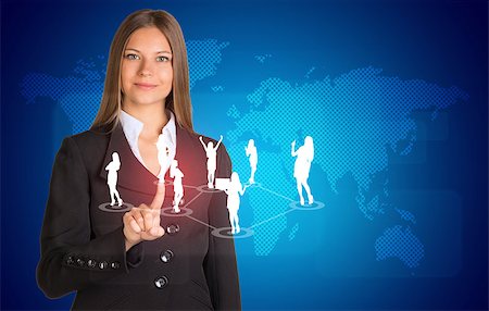 simsearch:400-07895693,k - Beautiful businesswoman in suit presses finger on virtual button. World map and business silhouettes in background Stock Photo - Budget Royalty-Free & Subscription, Code: 400-07895696