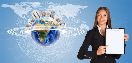 simsearch:400-07895693,k - Beautiful businesswoman in suit holding paper holder. Earth with buildings and figures in background. Elements of this image furnished by NASA Stock Photo - Budget Royalty-Free & Subscription, Code: 400-07895697