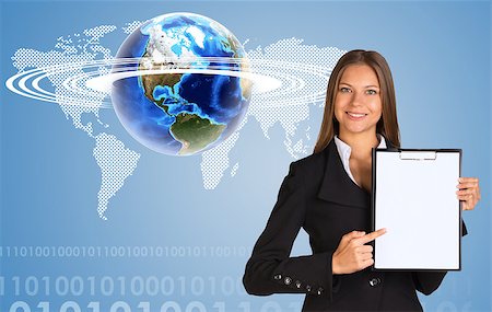 simsearch:400-07895693,k - Beautiful businesswoman in suit holding paper holder. Earth with world map in background. Elements of this image furnished by NASA Stock Photo - Budget Royalty-Free & Subscription, Code: 400-07895699