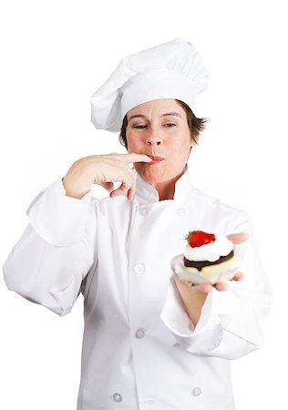 Pretty pastry cook in chef's whites tasting a delicious chocolate cheesecake tart with whipped cream and a cherry on top.  Isolated on white background. Stock Photo - Budget Royalty-Free & Subscription, Code: 400-07896353