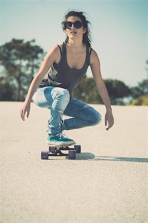 Young woman down the road with a skateboard Stock Photo - Budget Royalty-Free & Subscription, Code: 400-07896610