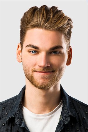 Studio portrait of a young fashion man Stock Photo - Budget Royalty-Free & Subscription, Code: 400-07896672