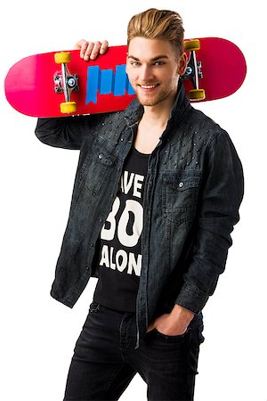 Studio portrait of a young man posing with a skateboard Stock Photo - Budget Royalty-Free & Subscription, Code: 400-07896681