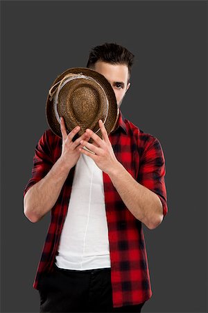 peeping fashion - Studio portrait of a handsome young man Stock Photo - Budget Royalty-Free & Subscription, Code: 400-07896695