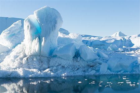 Beautiful Icebergs in Disko Bay Greenland around Ilulissat with blue sky Fotografie stock - Microstock e Abbonamento, Codice: 400-07896721