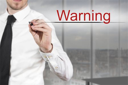 simsearch:400-08551867,k - businessman in office writing warning in the air Stock Photo - Budget Royalty-Free & Subscription, Code: 400-07897137