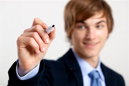 simsearch:400-05124201,k - Portrait of a young  businessman writting something on a glass writeboard Stockbilder - Microstock & Abonnement, Bildnummer: 400-07897661