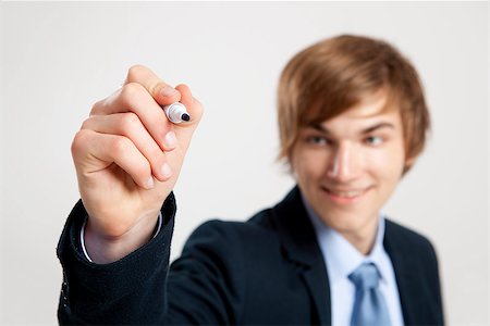 simsearch:400-05124201,k - Portrait of a young  businessman writting something on a glass writeboard Stockbilder - Microstock & Abonnement, Bildnummer: 400-07897662