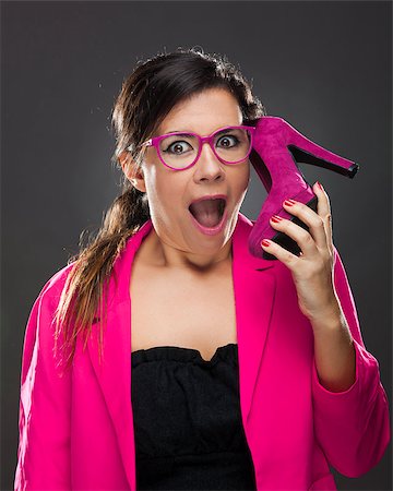 funny looking girls with glasses - Middle aged woman holding a shoe pretending it's a cell phone Stock Photo - Budget Royalty-Free & Subscription, Code: 400-07897705