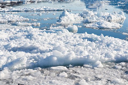 disko island - Floating Ice on the Ocean in Greenland with reflections of a blue sky in water Stock Photo - Budget Royalty-Free & Subscription, Code: 400-07897825