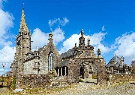 The parish of Guimiliau dedicated to St. Milio and dating 16-17 century. Brittany, France. Spring view. Stock Photo - Budget Royalty-Free & Subscription, Code: 400-07898014
