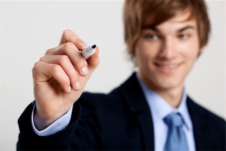 simsearch:400-05124201,k - Portrait of a young  businessman writting something on a glass writeboard Stockbilder - Microstock & Abonnement, Bildnummer: 400-07898734