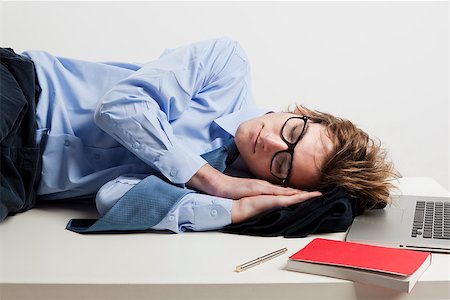 simsearch:400-08551867,k - Young man in the office and sleeping over is desk Stock Photo - Budget Royalty-Free & Subscription, Code: 400-07898775