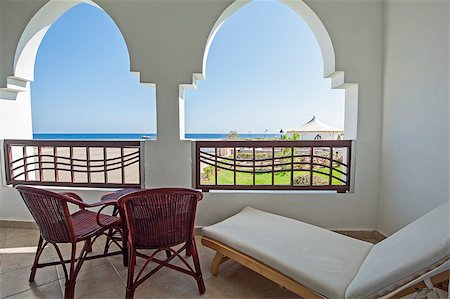 simsearch:649-08562431,k - Balcony of hotel room in luxury tropical resort with sea view Stock Photo - Budget Royalty-Free & Subscription, Code: 400-07899197