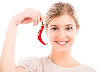 simsearch:400-04575822,k - Beautiful girl smiling and holding a red chilli pepper, isolated over a white background Photographie de stock - Aubaine LD & Abonnement, Code: 400-07899696