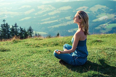 Young woman meditating outdoors Stock Photo - Budget Royalty-Free & Subscription, Code: 400-07891948