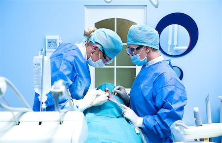 female with dental tools at work - Dental implantation procedure Stock Photo - Budget Royalty-Free & Subscription, Code: 400-07892121