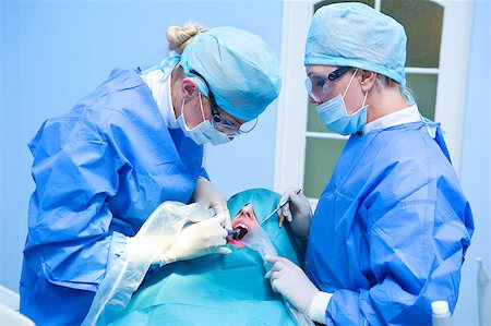 female with dental tools at work - Dental implantation procedure Stock Photo - Budget Royalty-Free & Subscription, Code: 400-07892122