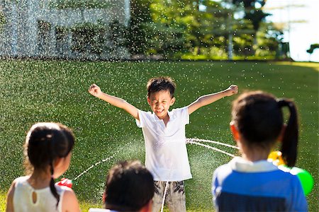 punishment girls - little boy Punishment for water gun spray to wet body Stock Photo - Budget Royalty-Free & Subscription, Code: 400-07892205