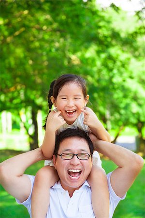 simsearch:400-07715953,k - little girl sitting father shoulder and make a funny facial expression Stock Photo - Budget Royalty-Free & Subscription, Code: 400-07892202