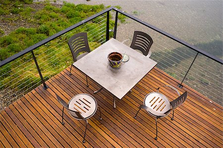 deck chair railing - A deck spans out over the water Stock Photo - Budget Royalty-Free & Subscription, Code: 400-07892243