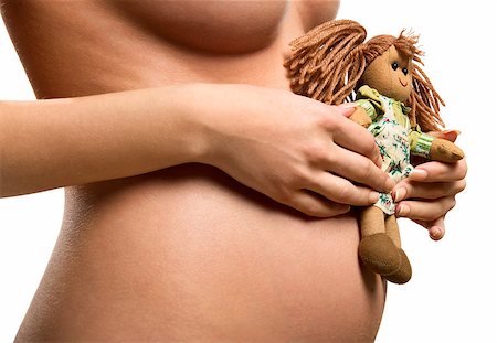 simsearch:400-04334843,k - Pregnant woman holding a doll Foto de stock - Royalty-Free Super Valor e Assinatura, Número: 400-07892376