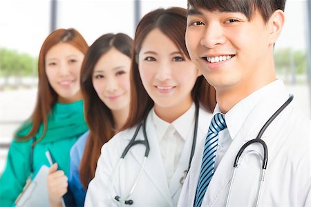 simsearch:400-07412766,k - Professional medical doctor team standing in office Foto de stock - Super Valor sin royalties y Suscripción, Código: 400-07892418