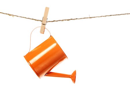 rope in wood - The watering can hanging on the rope isolated on white background Stock Photo - Budget Royalty-Free & Subscription, Code: 400-07892919