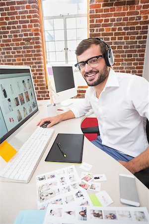 simsearch:400-07466593,k - Portrait of smiling male photo editor using computer in the office Stock Photo - Budget Royalty-Free & Subscription, Code: 400-07900360