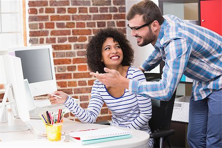 simsearch:400-07466593,k - Portrait of two smiling photo editors using computer in the office Stock Photo - Budget Royalty-Free & Subscription, Code: 400-07900375