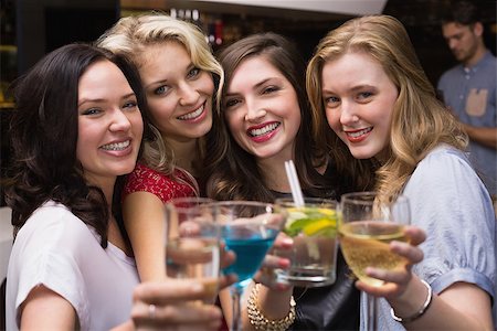 simsearch:6122-08212398,k - Pretty friends having a drink together at the bar Stock Photo - Budget Royalty-Free & Subscription, Code: 400-07900625