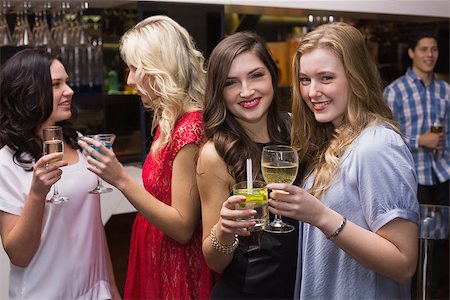 simsearch:6122-08212398,k - Pretty friends having a drink together at the bar Stock Photo - Budget Royalty-Free & Subscription, Code: 400-07900626