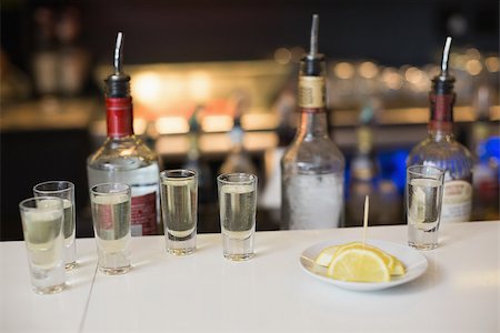 simsearch:400-04286082,k - Tequila shots and lemon slices at the bar Photographie de stock - Aubaine LD & Abonnement, Code: 400-07900671