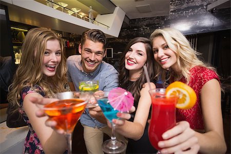 simsearch:649-06844392,k - Happy friends having a drink together at the bar Stock Photo - Budget Royalty-Free & Subscription, Code: 400-07900696