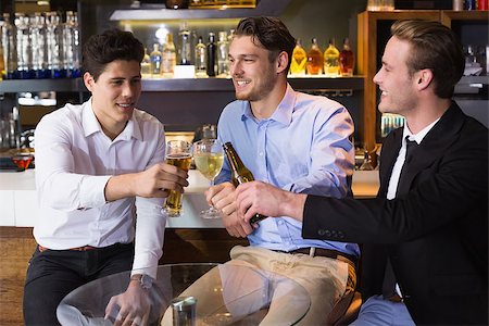 drink beer in suit - Handsome friends having a drink together at the bar Stock Photo - Budget Royalty-Free & Subscription, Code: 400-07900739