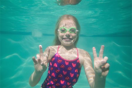 swimsuit underwater posing - Cute kid posing underwater in pool at the leisure center Stock Photo - Budget Royalty-Free & Subscription, Code: 400-07900869