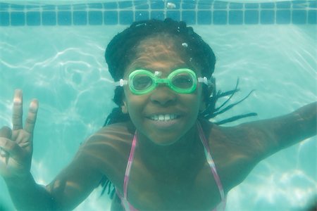 swimsuit underwater posing - Cute kid posing underwater in pool at the leisure center Stock Photo - Budget Royalty-Free & Subscription, Code: 400-07900861